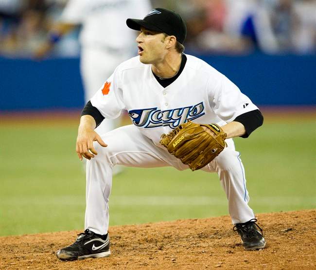 Toronto Blue Jays pitcher Jason Frasor appeals for a called third strike on the final out in the Jays win over the New York Yankees 7-1 in AL action in Toronto on Friday July 15, 2011. THE CANADIAN PRESS/Frank Gunn.