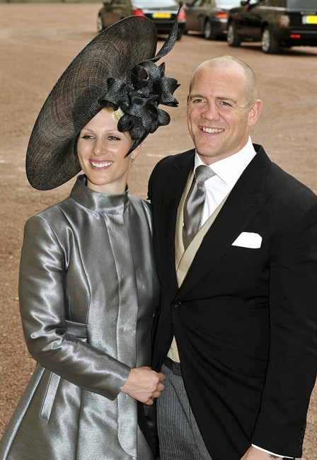FILE - In this April 29, 2011 file photo, Zara Phillips, left, and her fiance Mike Tindall leave the wedding reception for Britain's Prince William and Catherine Middleton at Buckingham Palace, London. Britain will celebrate its second royal wedding of the season Saturday, July 30, 2011, with equestrian star Zara Phillips - eldest granddaughter of Queen Elizabeth II - set to take center stage as she marries England rugby stalwart Mike Tindall. (AP Photo/John Stillwell, Pool-File).
