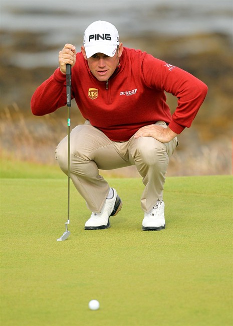 England's Lee Westwood lines up a putt during round one of the Scottish Open Golf Championship at the Castle Stuart golf course in Inverness Scotland Thursday July 7, 2011. (AP Photo/Lynne Cameron/PA) UNITED KINGDOM OUT NO SALES NO ARCHIVE.