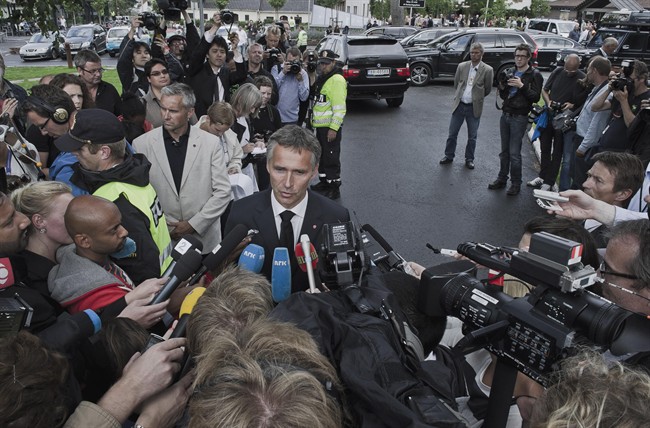 Norwegian Prime Minister Jens Stoltenberg, right, speaks to the media in Sundvollen, Norway Saturday July 23, 2011. A Norwegian gunman disguised as a police officer beckoned his victims closer before shooting them one by one, claiming at least 84 lives, in a horrific killing spree on an idyllic island teeming with youths that has left this peaceful Nordic nation in mourning. The island tragedy Friday unfolded hours after a massive explosion ripped through a high-rise building housing the prime minister's office, killing seven people. (AP Photo/ScanpixAleksander Andersen / Scanpix.