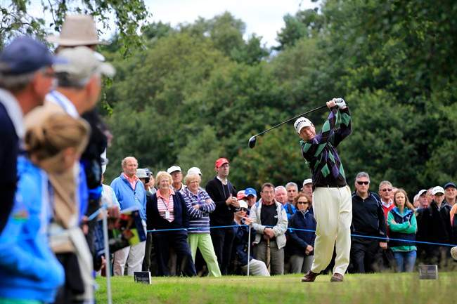 US's Tom Watson tees off on the 2nd hole during the third round of Senior British Open Championship at Walton Heath Golf Club in Walton On The Hill, England, Saturday, July 23, 2011. (AP Photo/Sang Tan).