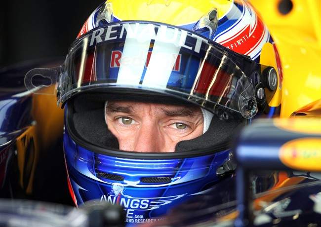 Australia's Red Bull Formula 1 driver Mark Webber waits in the pits during the third practice session at the Silverstone circuit, Silverstone, England, Saturday, July 9, 2011. The Formula One British Grand Prix at the 6-kilometer (3.7-mile) Silverstone circuit will take place on Sunday. (AP Photo/Tim Hales).