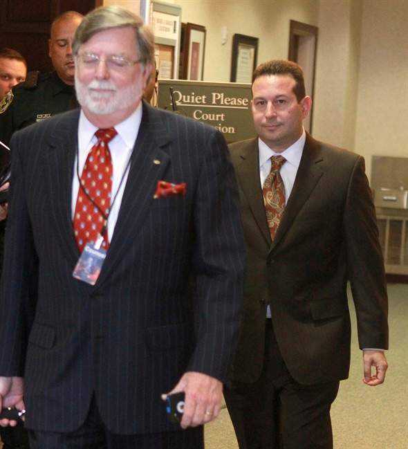 Cheney Mason, left, and Jose Baez leave the courtroom after their client, Casey Anthony, was found not guilty in her murder trial in Orlando, Fla., Tuesday, July 5, 2011. Anthony had been charged with killing her daughter, Caylee. (AP Photo/Joe Burbank,Pool).