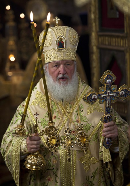 Orthodox Church Patriarch Kirill conducts a religious service at St. Basil's Cathedral outside the Kremlin on the Red Square in Moscow, Russia, Tuesday, July 12, 2011. The cathedral is turning 450 years on Tuesday, and parts of its interior will open after a decade-long restoration. Russia is observing a day of mourning for victims of a cruise ship sinking as divers work deep underwater in a Volga River reservoir to try to find more bodies. (AP Photo/Alexander Zemlianichenko).