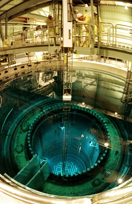 FILE - In this December 1985 file photo, workers refuel the core of the Vermont Yankee nuclear power plant in Vernon, Vt. The owner of Vermont's only nuclear power plant plans to move forward with a $60 million refueling this fall despite uncertainty about whether it will be able to operate beyond March, when its current operating license expires. (AP Photo/Toby Talbot, File).