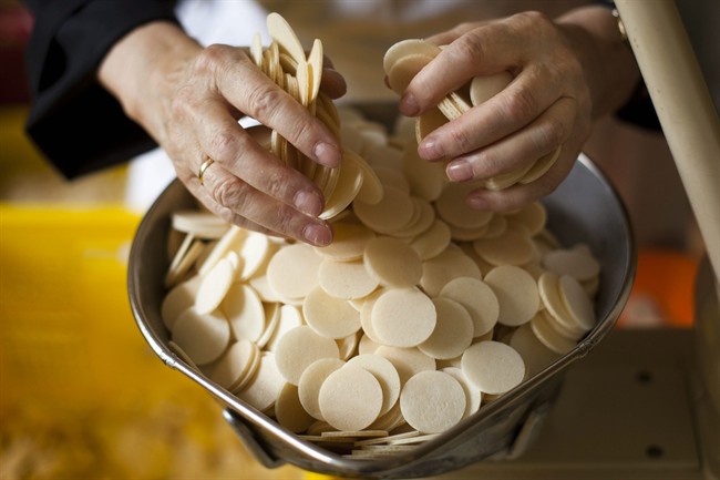 In this photo taken July 28, 2011, Sister Placida scales hosts at the Benedictine Abbey of St. Gertrud's host bakery in Alexanderdorf, Germany, about 50 kilometers (31 miles) south of Berlin. Pope Benedict XVI will not visit the Benedictine Abbey of St. Gertrud, but preparations for his trip are nevertheless in full swing, with the nuns baking thousands of communion wafers to be blessed by the pope at Masses during his September tour.(Photo/Markus Schreiber).