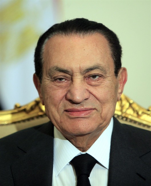 FILE - In this Feb. 8, 2011 file photo, Egyptian President Hosni Mubarak sits during his meeting with Emirates foreign minister, not pictured, at the Presidential palace in Cairo. Egypt's deputy justice minister says ousted President Hosni Mubarak will be brought to Cairo for his trial on charges of corruption and ordering the killings of protesters. Reports that Mubarak's health was faltering had raised speculation his trial, due to start Aug. 3, could be postponed or held in the Sinai resort where he has been undergoing treatment at a hospital. (AP Photo/Amr Nabil, File).
