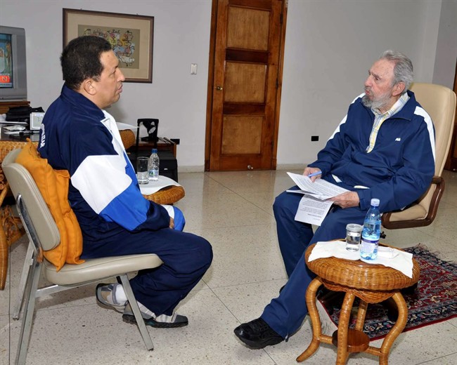FILE - In this undated file photo released by the state media Cubadebate web site, Venezuela's President Hugo Chavez and Cuba's Fidel Castro meet in an unknown location in Havana, Cuba. Chavez's battle with cancer has high stakes not only for his country but for Cuba, which relies on its South American ally for billions of dollars in preferential trade. If Chavez had to leave power, some Cubans even fear a return of conditions they endured during the 1990s when the disappearance of subsidies from the Soviet Union brought severe shortages of energy, food and medicine. (AP Photo/Cubadebate, Estudios Revolucion, File).