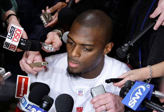 FILE - In this Jan. 30, 2008 file photo, New York Giants wide receiver Plaxico Burress answers questions for the media in Chandler, Ariz. The former Super Bowl star with the Giants, recently released from prison after serving 20 months on a gun charge, reached an agreement in principle Sunday, July 31, 2011, on a one-year deal with the New York Jets. (AP Photo/Julie Jacobson, File).