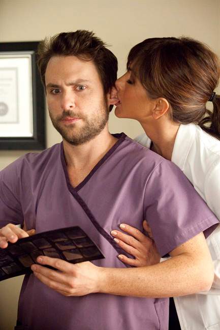 In this film publicity image released by Warner Bros. Pictures, Charlie Day, left, and Jennifer Aniston are shown in a scene from "Horrible Bosses." (AP Photo/Warner Bros. Pictures, John P. Johnson).