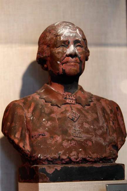 ADVANCE FOR USE SUNDAY, JULY 31, 2011 AND THEREAFTER - This Friday, June 24, 2011 photo shows a bust of Helen Keller scorched and covered in World Trade Center dust on display in New York. Besides ending nearly 3,000 lives, destroying planes and reducing buildings to tons of rubble and ash, the Sept. 11, 2001, attacks destroyed tens of thousands of records, irreplaceable historical documents and art. (AP Photo/Mary Altaffer).