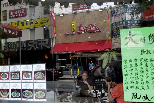 In this Tuesday, June 14, 2011 photo, signs primarily in languages other than English are displayed in the Flushing, Queens section of New York. New York City Council members are wading into a potential culture clash with a bill that would require 60 percent of a business' exterior sign to be in English, saying the signs are a public safety hazard and keep merchants from attracting a larger customer base. (AP Photo/Seth Wenig).