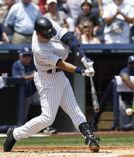 New York Yankees' Derek Jeter follows through on a single during the first inning of a baseball game against the Tampa Bay Rays, Saturday, July 9, 2011, at Yankee Stadium in New York. (AP Photo/Frank Franklin II).