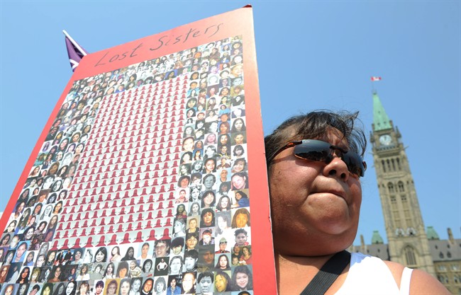 Jacqueline House of Six Nations of the Grand River territory takes part in a rally on Parliament Hill in solidarity with missing and murdered aboriginal women in Ottawa on Tuesday, July 5, 2011. THE CANADIAN PRESS/Sean Kilpatrick.