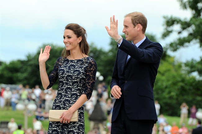 The Duke and the Duchess of Cambridge wave to the crowds as they take part in a ceremony at the National War Memorial in Ottawa on Thursday, June 30, 2011. THE CANADIAN PRESS/Sean Kilpatrick.