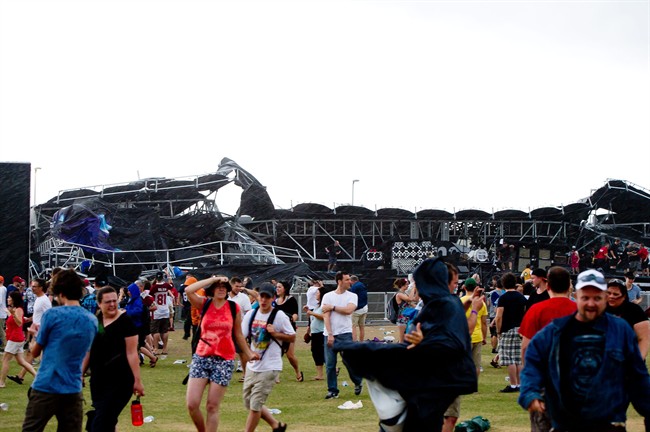 People run for cover as main stage at Ottawa Bluesfest collapses in Ottawa on Sunday July 17, 2011. The main stage at Ottawa Bluesfest collapsed during a severe thunderstorm that sent thousands of people running for cover. Bluesfest said there were no serious injuries. THE CANADIAN PRESS/Marc Desrosiers.
