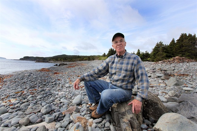 Tom Tobin, 78, shown on July 6, 2011, has lived near Ragged Beach, a pristine stretch of Newfoundland coastline 30 minutes outside St. John's for most of his life. A planned housing project along one of Newfoundland's prettiest coastlines has sparked a tense dispute as demand for seaside homes increases.At issue is a small subdivision proposed about 50 metres from the famed East Coast Trail — a hikers' paradise that draws international tourists to Witless Bay, N.L. THE CANADIAN PRESS/Paul Daly.