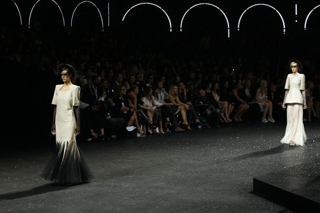 Models wear creations for the Chanel Fall-Winter 2011-2012 Haute Couture fashion collection presented in Paris, Tuesday, July 5, 2011. (AP Photo/Francois Mori).