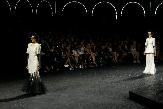 Models wear creations for the Chanel Fall-Winter 2011-2012 Haute Couture fashion collection presented in Paris, Tuesday, July 5, 2011. (AP Photo/Francois Mori).