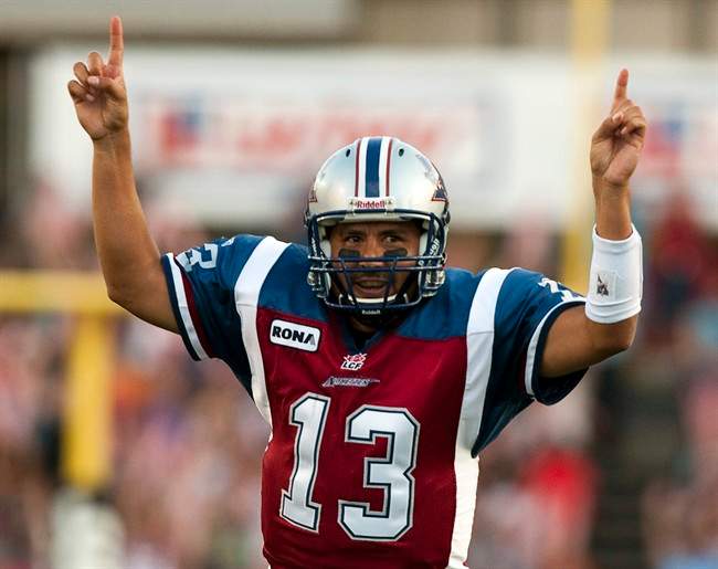 Montreal Alouettes quarterback Anthony Calvillo celebrates after throwing his 395th career touchdown to break Damon Allen's CFL record against the Toronto Argonauts during first quarter Canadian Football League action Friday, July 15, 2011 in Montreal. Calvillo threw his 395th career touchdown pass to Eric Deslauriers. THE CANADIAN PRESS/Ryan Remiorz.