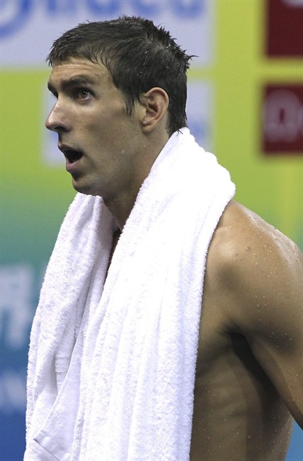 U.S. Michael Phelps leaves the pool after competing in the men's 4x100m Freestyle relay, at the FINA Swimming World Championships in Shanghai, China, Sunday, July 24, 2011. The U.S. team won the bronze medal. (AP Photo/Wong Maye-E).