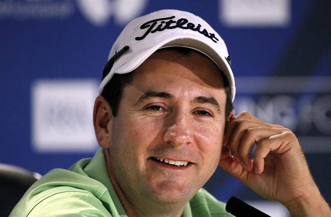 Ben Curtis from the U.S. speaks to the media during a press conference at Royal St. George's Golf Club, Sandwich, England, Monday, July, 11, 2011. (AP Photo/Peter Morrison).