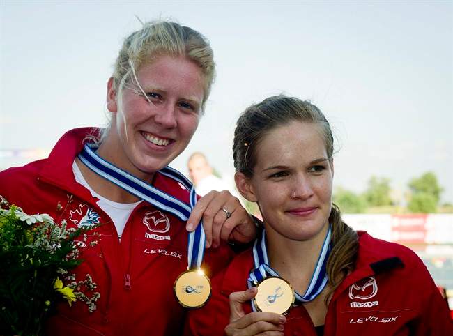 Laurence Vincent-Lapointe, left, and Mallorie Nicholson of Canada celebrate their gold medals during the medal ceremony of women's C2 500 meters race of the Canoe Sprint World Championships in Szeged, Hungary, Saturday, Aug. 20, 2011. (AP Photo/MTI, Tibor Illyes) HUNGARY OUT.