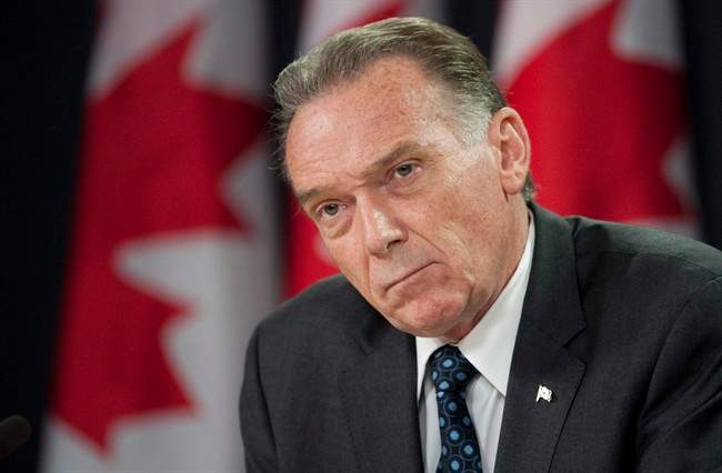 Minister of the Environment Peter Kent during a news conference in Ottawa, Thursday July 21, 2011. THE CANADIAN PRESS/Adrian Wyld.