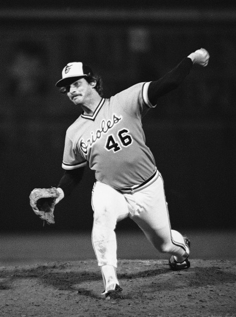 FILE - In this Oct. 10, 1979, file photo, Baltimore Orioles' Mike Flanagan throws to a Pittsburgh Pirates batter in Baltimore during the opening game of World Series. Former Cy Young winner Flanagan, who won 167 games over 18 seasons with Baltimore and Toronto, has died. Authorities found a body outside Flanagan's home on Wednesday afternoon, Aug. 24, 2011, and it was later determined to be the former left-handed pitcher. Flanagan was 59. The Orioles confirmed Flanagan's death Wednesday night. (AP Photo/File).