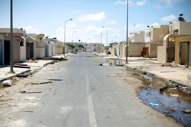 The picture shows an empty street in the town of Brega, Libya, Monday, Aug. 15, 2011. Most of the town has been liberated from Moammar Gadhafi's forces, with fights going on only at the oil terminal, according the rebel military spokesman, Ahmed Bani (AP Photo/Alexandre Meneghini).