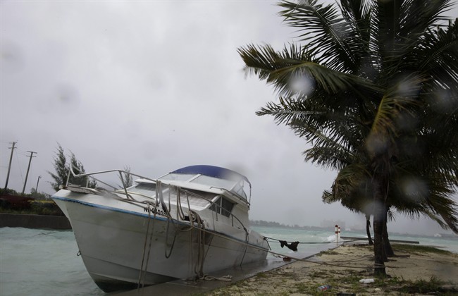 A boat hits against the seawall as bands of rain and wind from Hurricane Irene hit Nassau, on New Providence Island in the Bahamas, Wednesday, Aug. 24, 2011. Hubert Ingraham, the prime minister of the Bahamas says Hurricane Irene has caused isolated damage on its march up the island chain but so far no deaths or injuries. (AP Photo/Lynne Sladky).