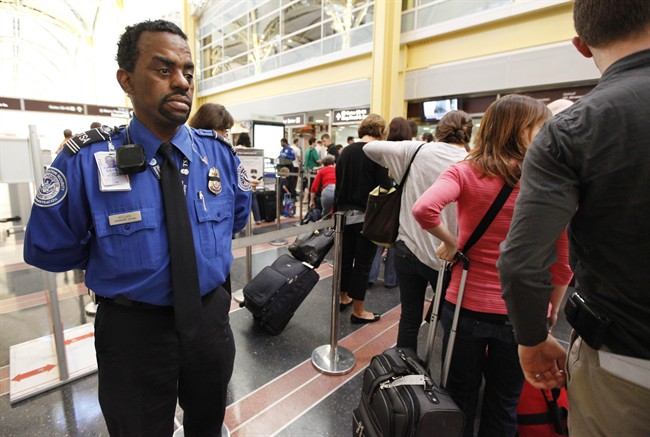 Transportation Security Administration's Behavior Detection Officer Terrence McClain, watches United Airlines passengers checking in for the morning flight at Washington's Ronald Reagan Washington National Airport, on April 8, 2010. Canada's privacy czar is concerned about the potential unfairness of a plan to scrutinize the flying public's behaviour at the airport. The federal government announced last year it would develop a passenger-behaviour observation program to detect terrorists. THE CANADIAN PRESS/AP, Manuel Balce Ceneta.