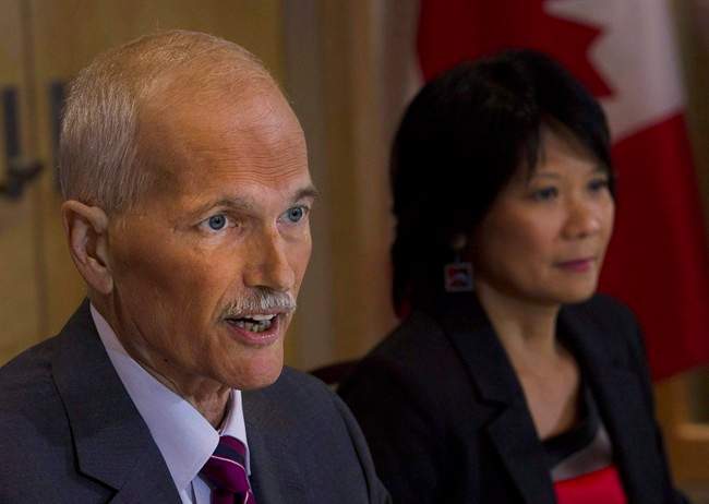 NDP Leader Jack Layton has died after a battle with cancer. Layton speaks to the media as his wife Olivia Chow looks on at a news conference in Toronto on Monday, July 25, 2011. THE CANADIAN PRESS/Nathan Denette.