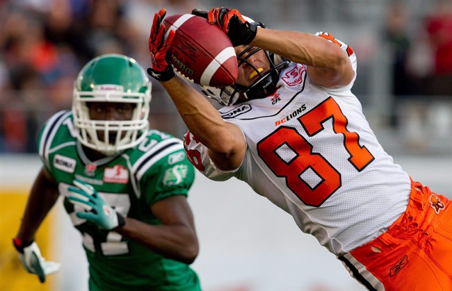 B.C. Lions' Marco Iannuzzi, right, hauls in a pass as Saskatchewan Roughriders' Nick Graham defends during the first half of a pre-season CFL football game in Vancouver, B.C., on June 22, 2011. Iannuzzi is waiting for his chance to show the B.C. Lions they made the right move in selecting him first overall in the CFL draft this year.THE CANADIAN PRESS/Darryl Dyck.