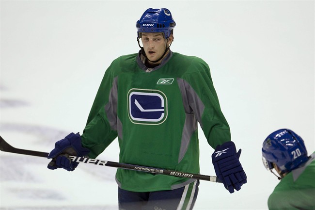 Former Vancouver Canuck Rick Rypien was found dead at his Alberta home Monday, Aug. 15, 2011. Vancouver Canucks Rick Rypien, left, speaks with teammate Ryan Parent during a Canucks practice session at Rogers Arena in Vancouver, Oct. 25, 2010. THE CANADIAN PRESS/Jonathan Hayward.