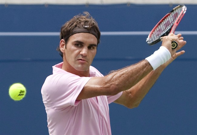 Roger Federer of Switzerland returns the ball during the final of Rogers Cup ATP tennis action in Toronto on August 15, 2010. It will be a new-look Rogers Cup this year with Toronto and Montreal each hosting tournaments during the same week. "Clearly I think it's a bit unfortunate for Canada to have two big events like this at the very same time," he said Wednesday Aug. 3, 2011. THE CANADIAN PRESS/ Nathan Denette.