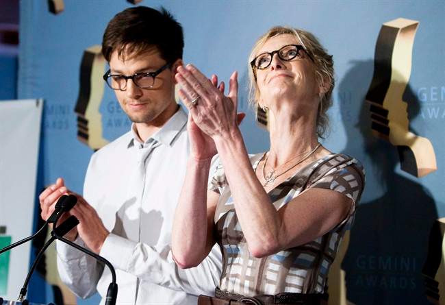 Sheila McCarthy, right, applauds after announcing the 2011 Gemini Award nomination for her late husband, Peter Donaldson, as she and Gregory Smith announce the nominations for the 26th annual Gemini Awards in Toronto on Wednesday, August 3, 2011. THE CANADIAN PRESS/Darren Calabrese.