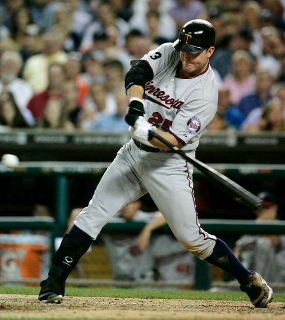 Minnesota Twins' Jim Thome swings for his 600th career home run during the seventh inning of a baseball game against the Detroit Tigers Monday, Aug. 15, 2011, in Detroit. Thome's home run was a three-run shot. (AP Photo/Duane Burleson).