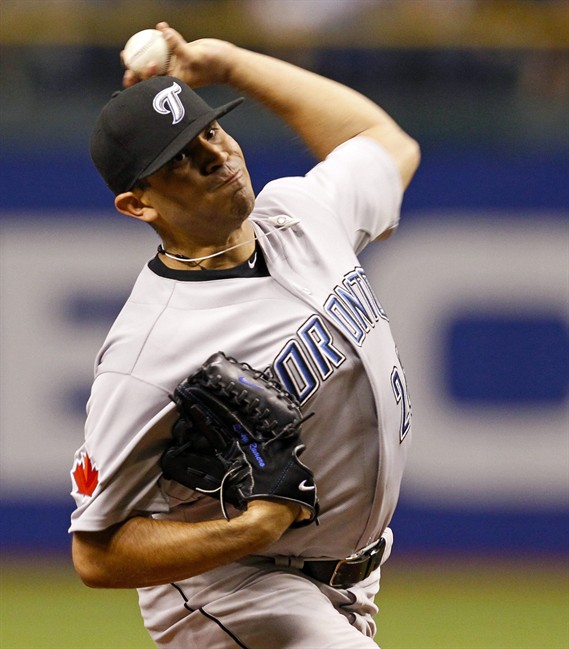 Toronto Blue Jays starting pitcher Ricky Romero throws during the fourth inning of a baseball game against the Tampa Bay Rays Tuesday, Aug. 2, 2011, in St. Petersburg, Fla. (AP Photo/Mike Carlson).