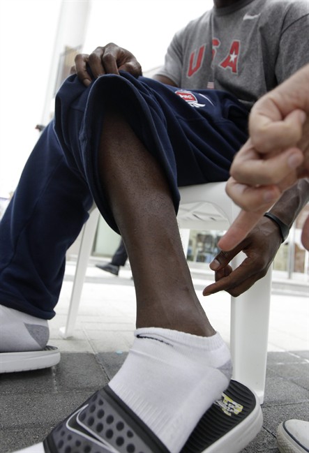 US sprinter Justin Gatlin points to a frostbite scar on his leg during an interview with the Associated Press in Daegu, South Korea, Wednesday, Aug. 24, 2011. The World Athletics Championships run Aug. 27 through Sept. 4, 2011 in Daegu. (AP Photo/David J. Phillip).