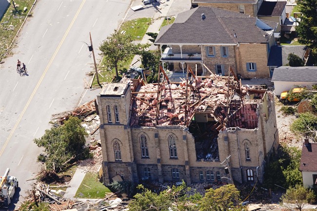 A church in downtown Goderich, Ontario sits in ruins Monday, August 22, 2011, after a tornado ripped through the town Sunday, killing one person. Residents of a town dubbed the prettiest in Canada returned this morning to homes demolished by the most powerful tornado to hit Ontario in years, dissolving into tears as the depth of the devastation sank in. THE CANADIAN PRESS/Geoff Robins.