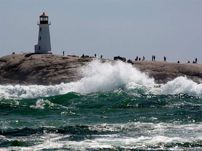 Waves pound the rocks at Peggys Cove, N.S. on Monday, Aug. 29, 2011. The remnants of hurricane Irene buffeted the province with high winds and rain.THE CANADIAN PRESS/Andrew Vaughan.