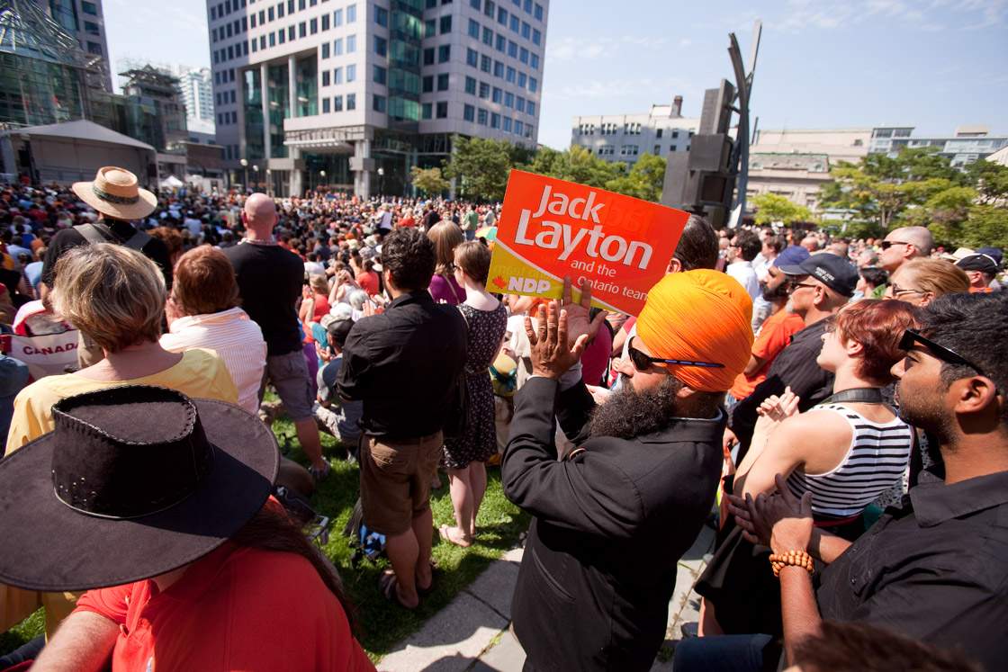 Thousands gathered outside Roy Thompson Hall in Toronto, Ontario, on August 27, 2011 to watch the broadcast of the state funeral of Canadian opposition leader Jack Layton.