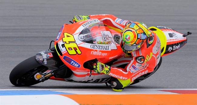 Ducati Rider Valentino Rossi from Italy speeds up during the MotoGP qualification of the Czech Motorcycle Grand Prix at Masaryk circuit in Brno, Czech Republic, Saturday, Aug. 13, 2011. He placed 6th. The Grand Prix of Czech Republic will take place on Sunday Aug. 14, 2011. (AP Photo/Jens Meyer).