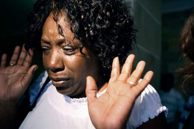 Ablene Cooper leaves a Hinds County courtroom in Jackson, Miss., Tuesday, Aug. 16, 2011, after a circuit judge dismissed her lawsuit against Kathryn Stockett, author of the best-selling novel "The Help." "The Help" was made into a movie that opened last week. It's based on relationships between white families and the African-American women who worked for them in the 1960s. The lawsuit was filed by Cooper, who works for Stockett's brother. She claims a main character, Aibileen, is based on her. Cooper accuses Stockett of using her name and likeness without permission. (AP Photo/Rogelio V. Solis).