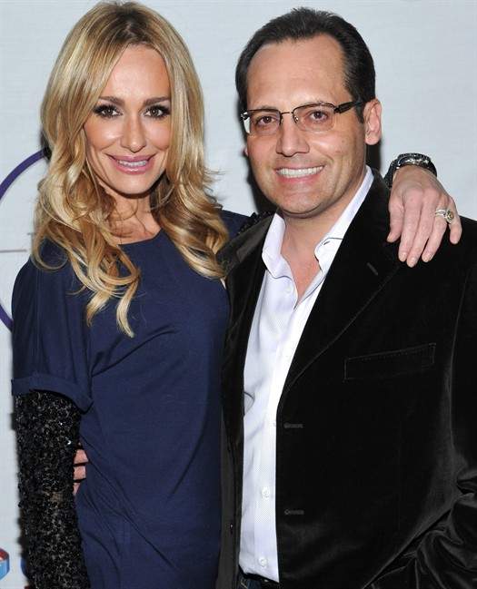FILE - In this Feb. 5,2011 file photo, television personality Taylor Armstrong, left, and husband Russell Armstrong attend a Super Bowl party in Dallas, Texas. Russell Armstrong, the estranged husband of "Real Housewives of Beverly Hills" star Taylor Armstrong, has been found dead in his Los Angeles home. (AP Photo/Evan Agostini,File).