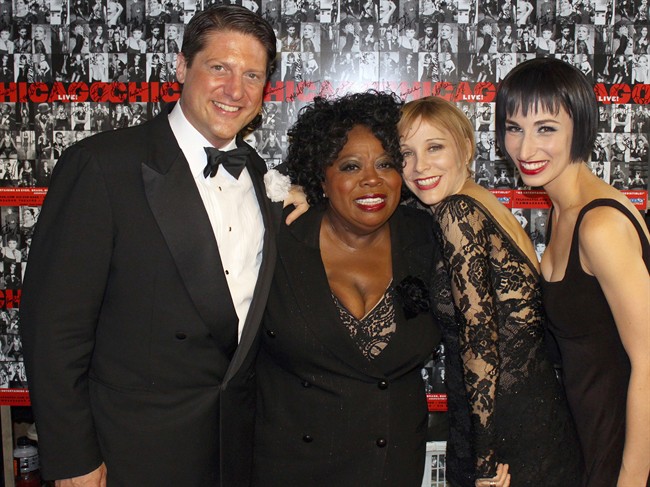 In this photo provided by The Publicity Office, from left, "Chicago" cast members Christopher Sieber, Carol Woods, Nikka Graff Lanzarone and Charlotte d'Amboise pose for a photo Friday, Aug. 26, 2011, in New York. The cast and crew of the musical "Chicago" celebrated a Broadway milestone with a small backstage party at intermission, as the show marked its 6,137th performance _ tying "A Chorus Line" for the fourth longest-running show in Broadway history. (AP Photo/The Publicity Office, Jeremy Daniel).