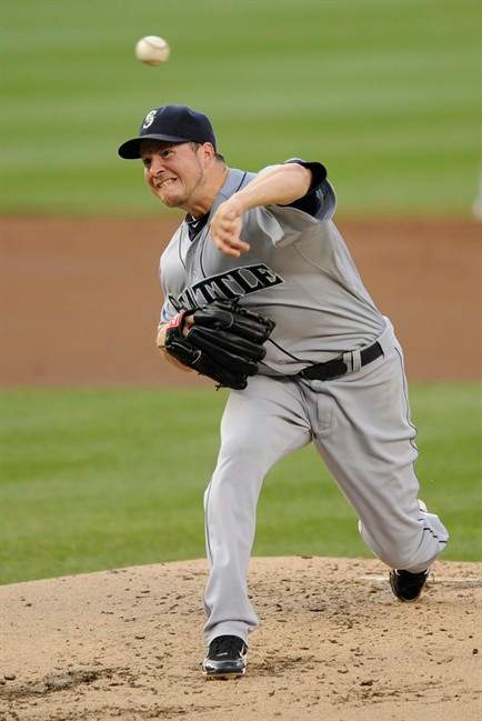 In this June 22, 2011, photo, Seattle Mariners starting pitcher Erik Bedard throws to the Washington Nationals during a baseball game in Washington. The Boston Red Sox have added a much-needed starter after an earlier trade fell through, acquiring oft-injured left-hander Bedard from the Mariners in a three-team trade. (AP Photo/Nick Wass).
