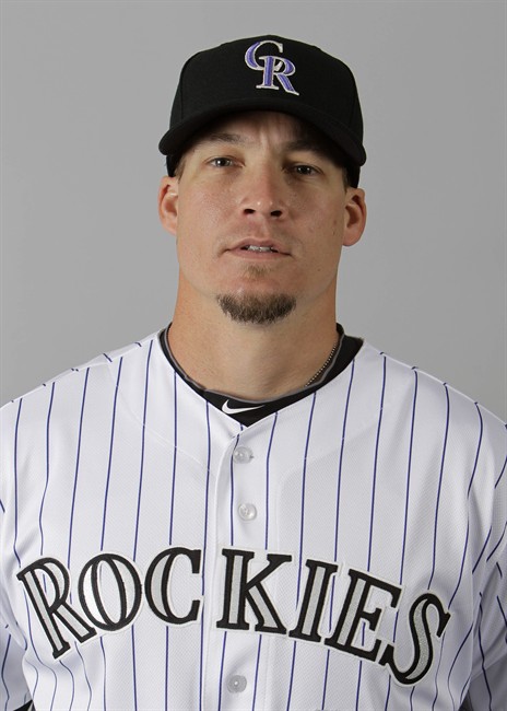 FIEL - This is a 2011 file photo showing Colorado Rockies infielder Mike Jacobs. Jacobs is the first player suspended by Major League Baseball for a positive HGH test. The 30-year-old minor league first baseman and former major leaguer received a 50-game suspension Thursday, Aug. 18, 2011, for taking the banned performance-enhancing substance and was subsequently released by the Rockies. (AP Photo/Mark Duncan, File).