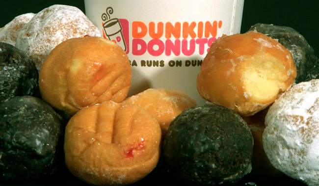 FILE - In this July 27, 2011 file photo, Dunkin' Donuts products are displayed in Montpelier, Vt. Dunkin' Brands Group Inc., which went public last month, said Wednesday, Aug. 3, 2011, that its second-quarter earnings were nearly flat as the company focused on its U.S. expansion efforts and aggressive growth overseas.(AP Photo/Toby Talbot, File).